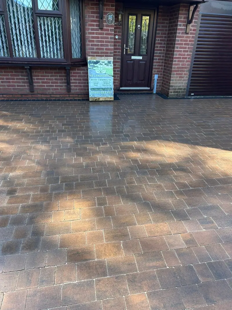 Block-paved driveway finished across the front of a home