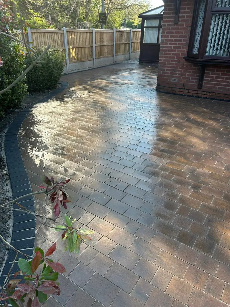 Curved block-paved driveway with contrasting dark border
